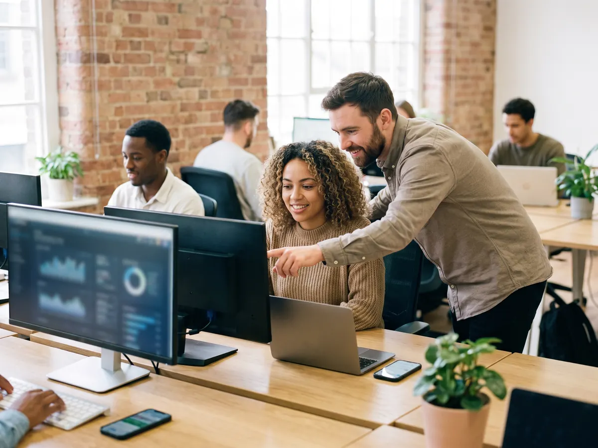 A team of cyber security analysts in a meeting