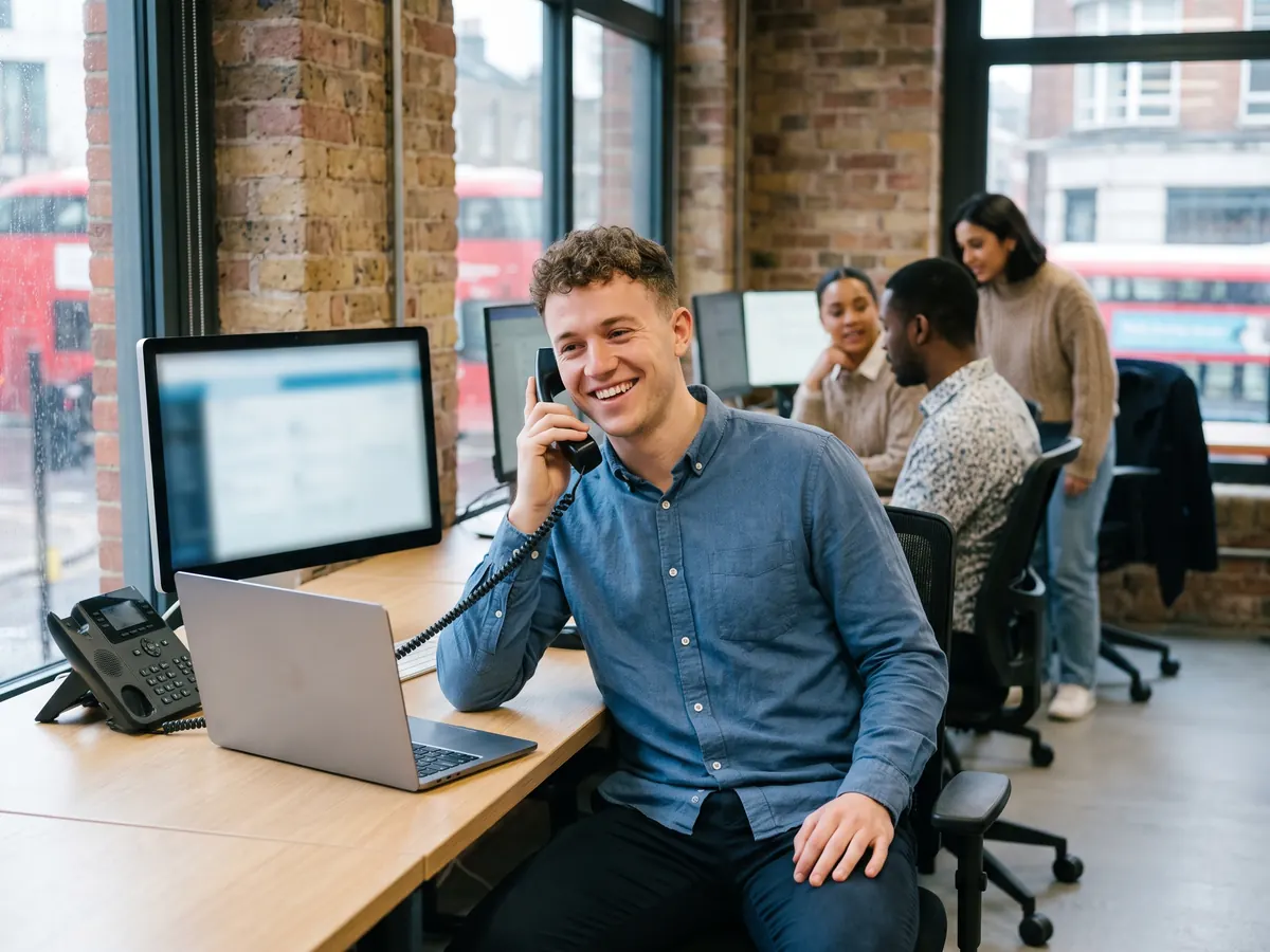 A small business owner talking on the phone